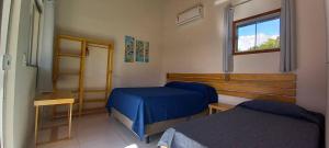 a room with two beds and a window at Casa Sol in Prado +20 photos