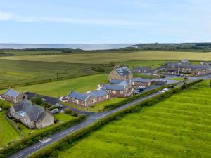 an aerial view of a house with a road at The Retreat in Alnwick