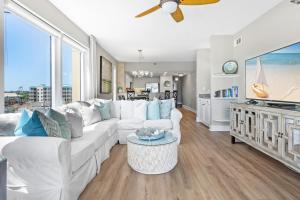 a living room with a white couch and a large window at Jade East Towers 0550 by Newman-Dailey in Destin