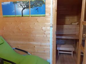 a sauna with a bench in a wooden house at Sport penzion, Železná Ruda in Železná Ruda +6 photos
