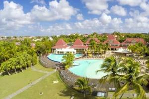 an aerial view of a resort with a swimming pool at Le Colibri du Paradis in Sainte-Anne