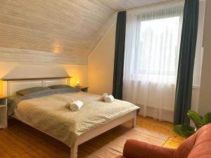 Posteľ alebo postele v izbe v ubytovaní Zöldike apartman Tiszafüred