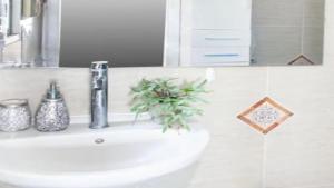 a white sink in a bathroom with a mirror at Casa Son Juvera Andratx in Andratx