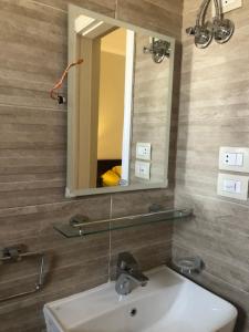 a bathroom with a sink and a mirror at 4 bedrooms 4 bathrooms Villa at the beautiful Ghazala Bay- North Coast - Egypt in Dawwār Abū Maḩrūs +21 photos