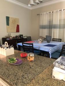 a kitchen with a counter and a table with a tableablish at 4 bedrooms 4 bathrooms Villa at the beautiful Ghazala Bay- North Coast - Egypt in Dawwār Abū Maḩrūs