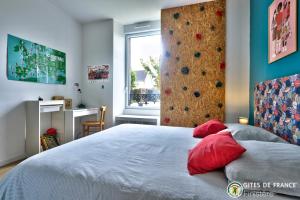 a bedroom with a large bed with a rock wall at Magnifique demeure à 15 min des plages 12 adultes in Saint-Renan +29 photos