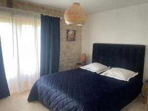 Postel nebo postele na pokoji v ubytování Grange avec vue, proche de Sarlat, calme et dépaysement au coeur du Lot + 29 fotografií