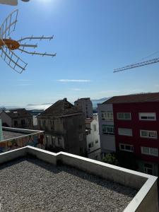 a view of a city from the roof of a building at Vellosol in Vigo