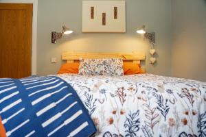 A bed or beds in a room at Cluain Abhainn 2-4 guests, private entrance