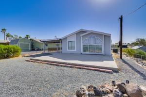 a house on a gravel driveway with a building at 5 Mi to River Topock Boating and Off-Roading Oasis! in Topock