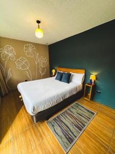 Hotel Agave Baños客房内的一张或多张床位