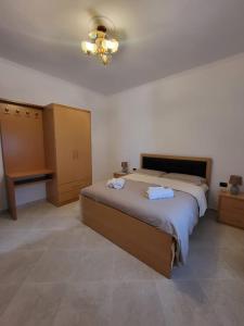 Postel nebo postele na pokoji v ubytování Vila Vokopola