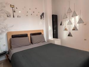 a bedroom with a bed and a wall with stars at Villa Vana in Possidi
