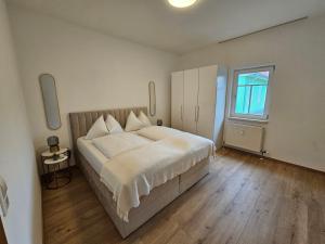 Postel nebo postele na pokoji v ubytování Flat Bull Appartement mit Garten