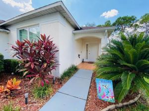 a house with a walkway in front of it at Beautiful Southern Dunes Villa Golf Course Views in Haines City