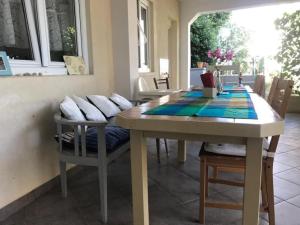 a dining room with a table and chairs at Vila Klara- Blue room in Olib