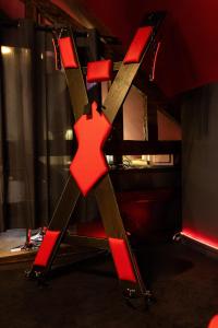 a red cross on a chair in a room at Urban Spa 3 nuances de plaisir in Troyes