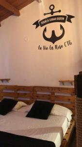 Postel nebo postele na pokoji v ubytování La Vie En Rose CTG