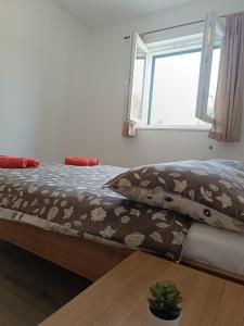 Posteľ alebo postele v izbe v ubytovaní Apartments Antonia