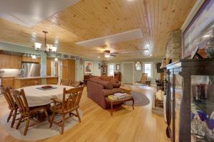 a kitchen and living room with a table and a couch at Creekside Newland Cabin about 7 Mi to Linville Falls in Newland