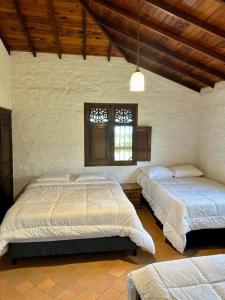Postel nebo postele na pokoji v ubytování Villa privada Eje Cafetero + 37 fotografií