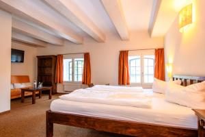 Postel nebo postele na pokoji v ubytování Hotel Stadtgut