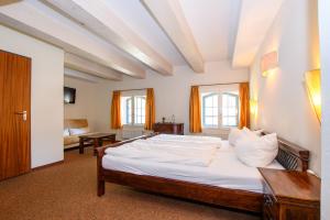 Postel nebo postele na pokoji v ubytování Hotel Stadtgut