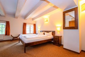 Postel nebo postele na pokoji v ubytování Hotel Stadtgut