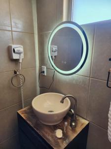 a bathroom with a sink and a mirror at Chocolate condo in San Felipe +1 photo