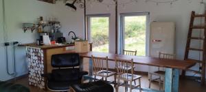 a kitchen with a wooden counter top in a room at A Cascada do Ézaro in Dumbría
