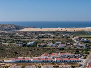 an aerial view of a beach and houses at Casa Barranco in Carrapateira