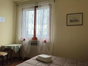 A bed or beds in a room at Villa del Biondo