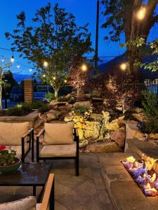 a garden at night with a fire pit at Art City Inn in Springville