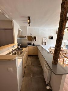 a kitchen with a sink and a counter top at Apartamento DALIA in La Molina