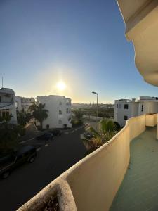a view from a balcony of a parking lot at Vue sur mer in El Harhoura