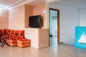 TV a/nebo společenská místnost v ubytování Villa de luxe vue sur mer