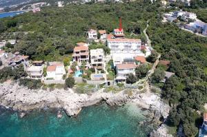 an aerial view of a house on a rocky island at Cozy Place in Utjeha