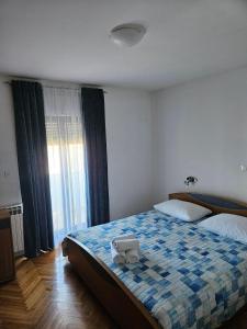 Postel nebo postele na pokoji v ubytování Apartments by the sea Kali, Ugljan - 17665