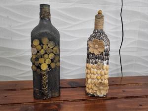 two bottles sitting on top of a wooden table at BnB Ecostay in San José