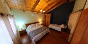 Ένα ή περισσότερα κρεβάτια σε δωμάτιο στο Hotel casona de los ríos