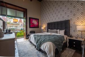 Postel nebo postele na pokoji v ubytování 1850 Hotel Boutique