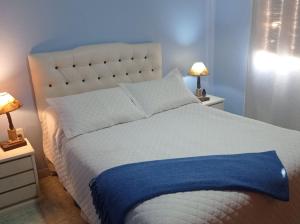 Ein Bett oder Betten in einem Zimmer der Unterkunft El Arrayan " No acepta mascotas"