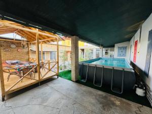 a house with a swimming pool in the yard at Nemo Guest House in Bukhara