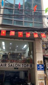 an air salon top sign in front of a building at Era Apartment La Thành in Hanoi