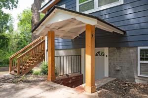 awning over a front porch of a house at Chic 2-Bed Haven with Vibrant Décor in SE Atlanta in Atlanta