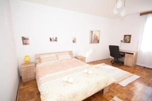 a bedroom with a bed with two candles on it at Apartments City Hall in Belgrade