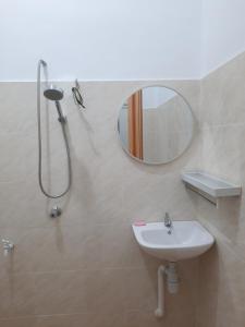 a bathroom with a shower and a sink and a mirror at Homestay sekamat ,kajang in Kajang +17 photos