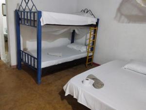 Hostal La Cabaña客房内的一张或多张床位
