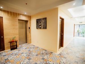 Postel nebo postele na pokoji v ubytování ARC Homes Hotel Panglao powered by Cocotel