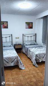 Postel nebo postele na pokoji v ubytování Apto Palacios con Piscina y Parking